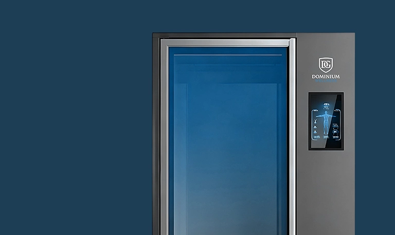 Premium cryotherapy chamber featuring the Dominium Wellness logo.